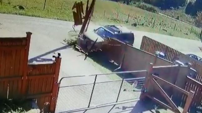Watch: Distracted driver crashes through two fences and a power pole