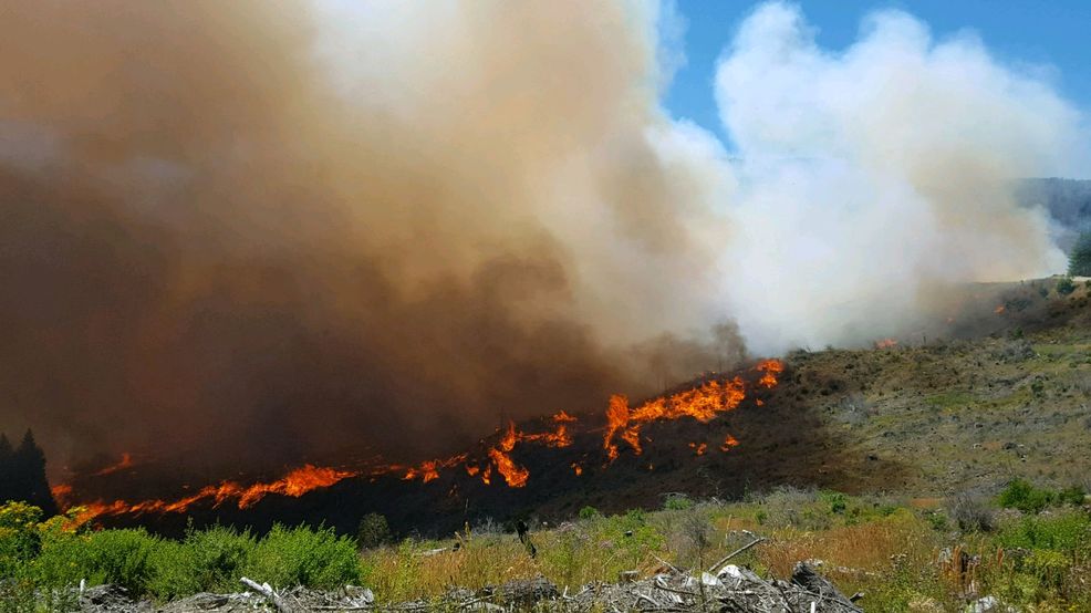 Firefighters battling blaze near Gold Beach, currently estimated at 300